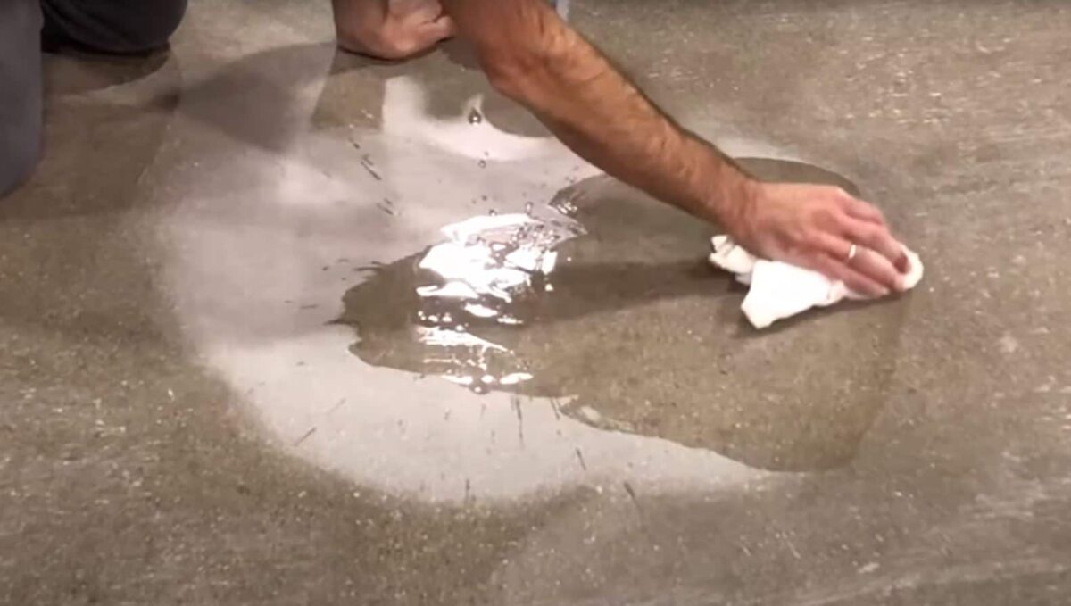 What should I do if a chemical spills on my polished concrete floor?